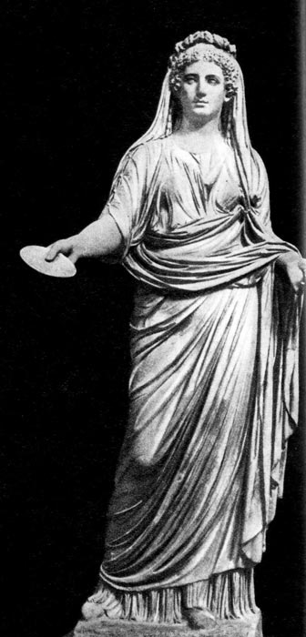 89. Т. н. Ливия, скульптура из Помпеи. Национальный музей, Неаполь. Молодая римлянка одета в столу и обернута в паллу, которой прикрыта и голова. Волосы, по тогдашней моде, завиты. 